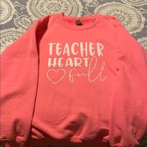 Pink sweatshirt with teacher quote graphic